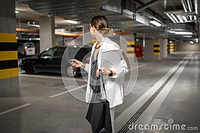 Woman in the underground car parking Stock Photo