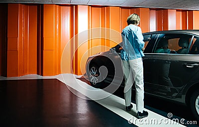 Woman in underground parking with Skoda Octavia car Editorial Stock Photo