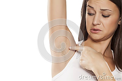 Woman with unshaved armpit Stock Photo