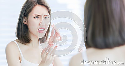 Woman use oil blotting paper Stock Photo