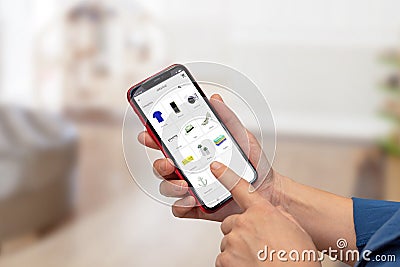 Woman use online shop app on smart phone. Close-up scene with shopping app concept Stock Photo