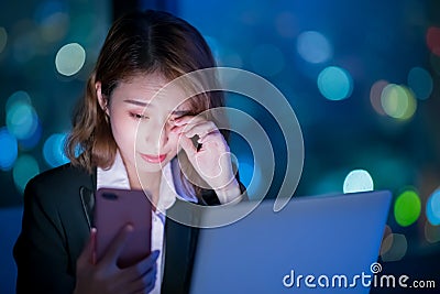 Woman use phone at night Stock Photo