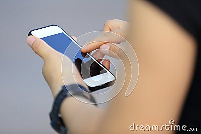 Woman use smart phone in modern city Stock Photo