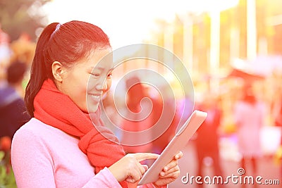 Woman use tablet in street Stock Photo