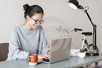 Woman using computer laptop happily Stock Photo
