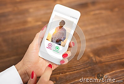 Woman using dating app and swiping user photos Stock Photo