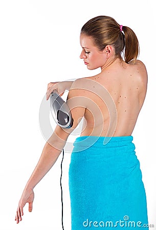 Woman using electric massager Stock Photo