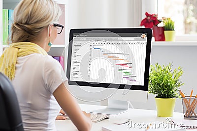 Woman using Gantt chart for project management Stock Photo