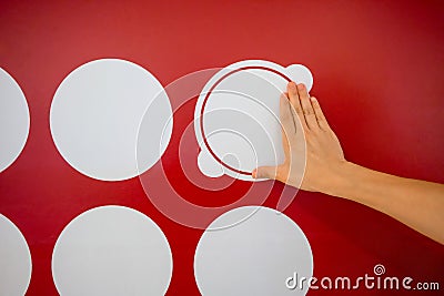 Woman using hands with dot graphic on red wall. Business info gr Stock Photo