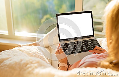 Woman using laptop computer with blank white screen Stock Photo