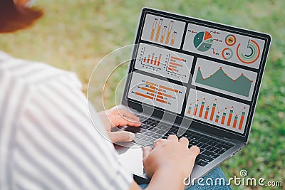 Woman using laptop or notebook computer with data analysis graph dashboard, confident woman working with computer laptop concept, Stock Photo
