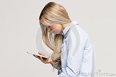 Woman using mobile phone with scoliosis, side view. Rachiocampsis, kyphosis curvature of the spine, incorrect posture, scoliosis, Stock Photo