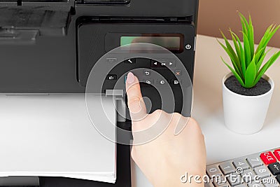 Woman using the printer to scanning and printing document Stock Photo