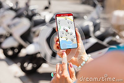 Woman using ride sharing app on phone Editorial Stock Photo