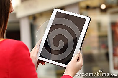 Woman using and showing a blank tablet screen Stock Photo