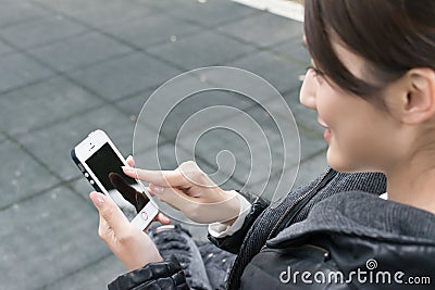 Woman using smartphone Stock Photo