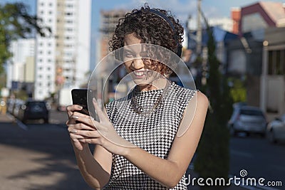 Woman using smartphone to make video call Stock Photo