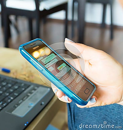 Woman using Whatsapp Editorial Stock Photo