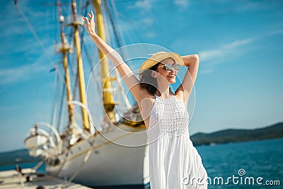 Woman on vacation walking trought marina Stock Photo