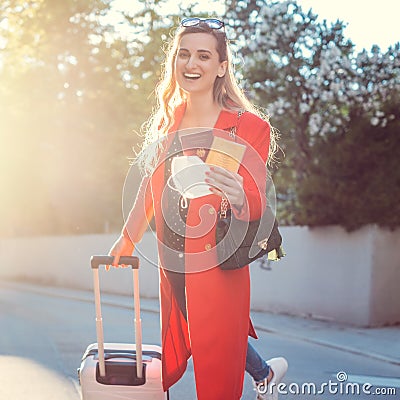 Woman with vaccination passport and mask ready to travel Stock Photo