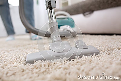 Woman with Vacuum Cleaner Stock Photo