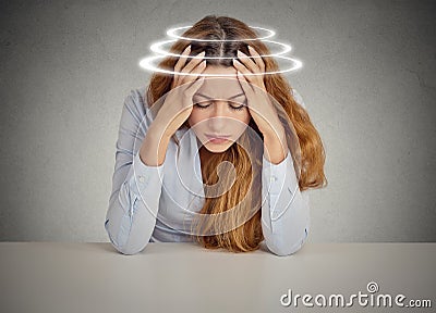 Woman with vertigo. Young female patient suffering from dizziness Stock Photo