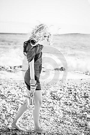 https://thumbs.dreamstime.com/x/woman-very-sad-beach-black-white-portrait-beautiful-blond-caucasian-girl-wearing-black-party-dress-walking-down-31516905.jpg