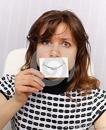 Woman with very unnatural smile on face Stock Photo