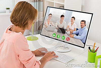 Woman Videoconferencing On Computer Stock Photo