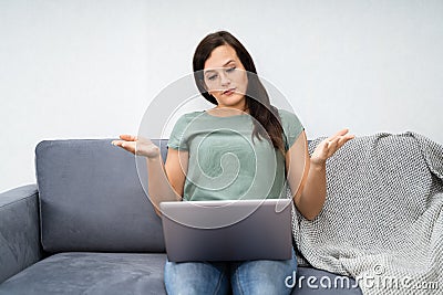 Woman Videoconferencing On Laptop Stock Photo