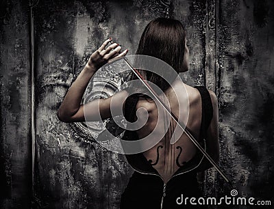 Woman with violin body art Stock Photo