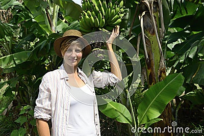 Woman visiting banana plantation Stock Photo