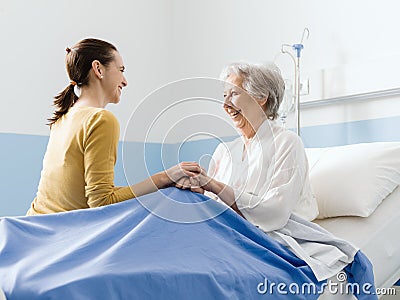 Woman visiting her grandmother at the hospital Stock Photo