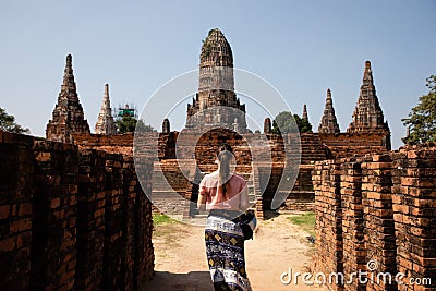 Woman visiting thai temple ruins in Ayuthaya Stock Photo