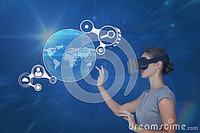 Woman in VR headset touching interface against blue background with flares Stock Photo