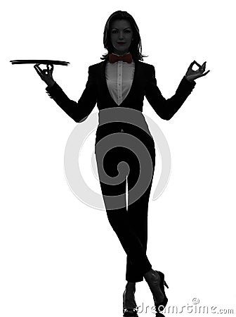 Woman waiter butler holding empty tray zen gesturing silhouette Stock Photo