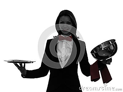 Woman waiter butler opening catering dome silhouette Stock Photo