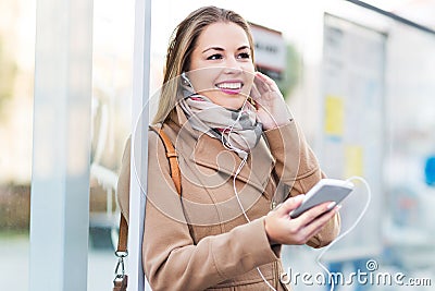 Woman Waiting at Bus Stop Stock Photo