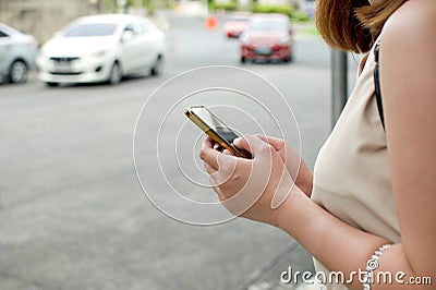 A woman waiting for a cab Stock Photo