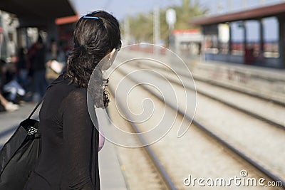 Woman waiting for train Stock Photo