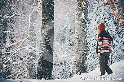 Woman walking alone in winter forest Travel Lifestyle Stock Photo