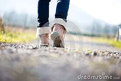 Woman walking along a rural path Stock Photo