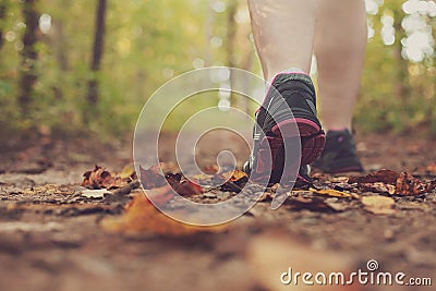 Woman walking through forest. Stock Photo