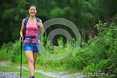 Woman walking on hiking trail Stock Photo