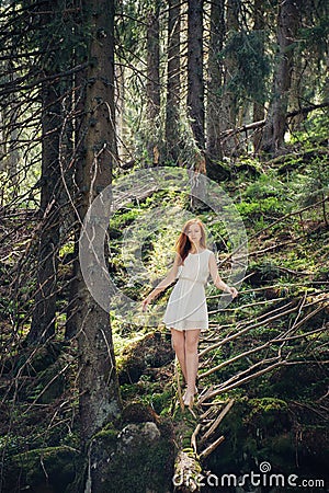 Woman walking in the mystery forest Stock Photo