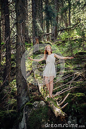 Woman walking in the mystery forest Stock Photo