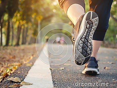 Woman walking in Park outdoor Workout Trail Exercise Healthy lifestyle Stock Photo