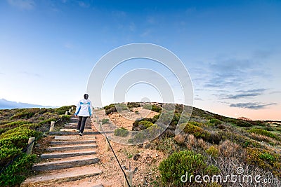 Woman walking up the pathway at Hallett Cove Stock Photo