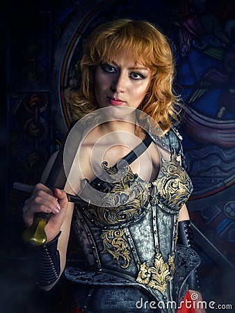 Woman warrior in medieval armor. Stock Photo