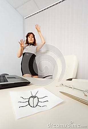 Woman was frightened drawn cockroach Stock Photo